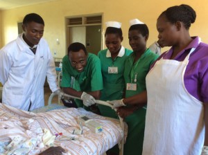 Paul Kipsongi Limo (2nd from left) and other staff with i-STAT at Mbale Hospital