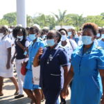 Health workers in uniform walking together