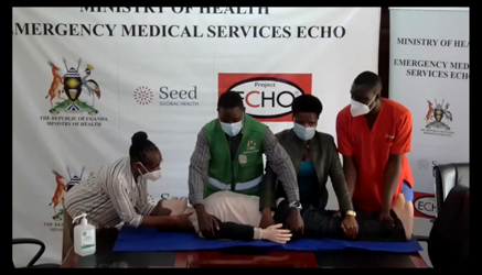 Experts demonstrate how to move an emergency patient during an emergency medicine ECHO virtual learning session.