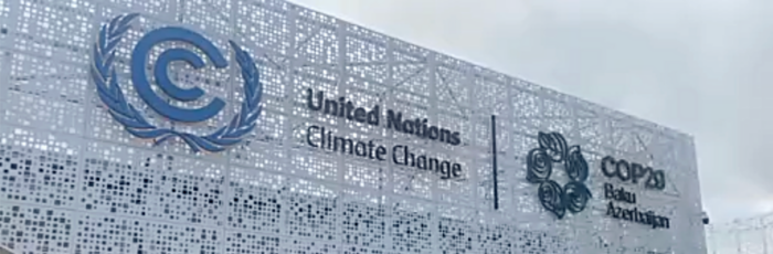 A photo of the COP29 Azerbaijan building with the UN Climate Change and COP29 logos.