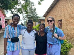 Seed Educator Kelsey Renning (right) with three nursing students, who arrived at the Manja emergency displacement camp in Malawi to help with response efforts after the Cyclone in 2023.