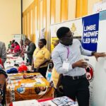 Richard Malirakwenda, Seed’s Midwifery Advisor in Malawi, presenting the organization's work to the minister and conference participants