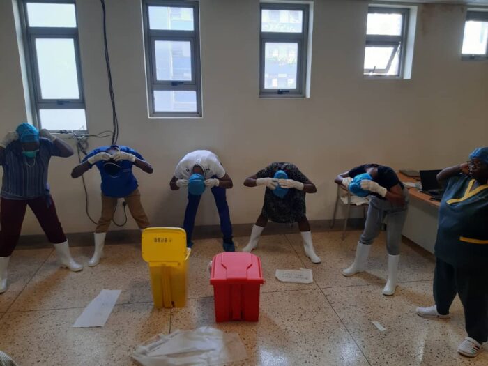 Health workers at Mulago National Referral Hospital in Uganda participating in practical elements of the specialised infection and prevention control training.