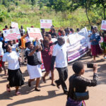 A parade by health workers and the community to begin the community-centred maternity care open day in Sumbuleta Village, Malawi.