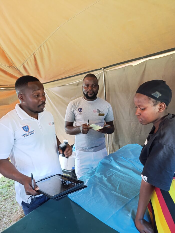 Midwives interacting with a community member during the community-centred maternity care open day in Sumbuleta Village, Malawi.